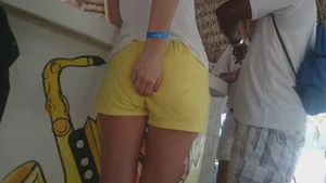 Milf in yellow shorts with vpl and a wedgie