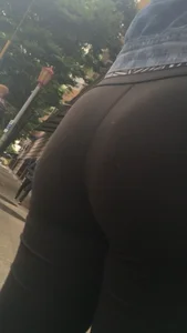 Girl with a nice ass in leggings walking down the street