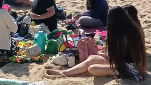Beautiful Teen with Miniskirt resting on the beach