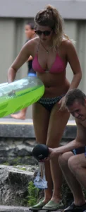Blonde bikini girl at the pool in pink bikini top with amazing tits