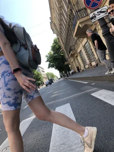 Cute candid girl in tight shorts on a crosswalk