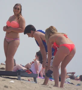 Sexy thick blonde girl with tiny bikini and big booty on the beach