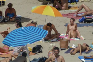 Girls on a nude beach in Sitges, Spain