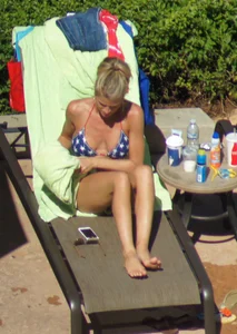 Blonde babe at the pool with sexy body in USA bikini