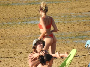 Hot ass beach blonde babe in little red thong