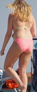 Thick blonde bikini babe on the beach
