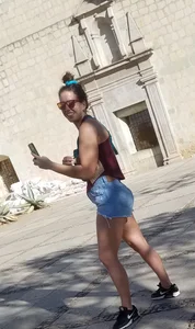 Laughing girl in shorts, legs and thick peach