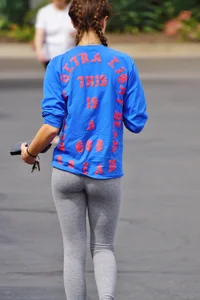Hot college girl getting food in grey leggings