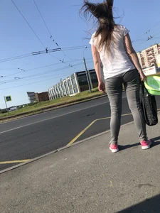 Nice candid girl wearing tight grey sweatpants, a mask and a hat