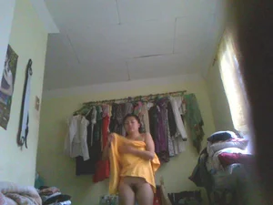 Hidden camera pics of a petite Asian in her room changing
