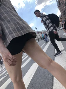 Closeups of a gorgeous girl wearing spandex mini shorts crossing the street