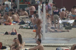 Topless girls on a beach in Barcelona