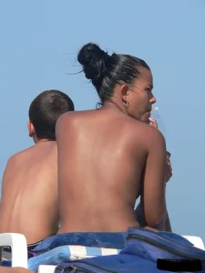 Hot ass topless beach girl with great tits lets her little brother oil up her ass in thong bikini