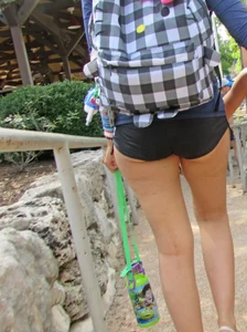 Girl with slight cheeks in little spandex shorts