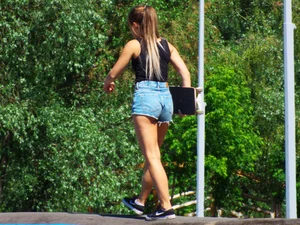 Skateboard Girl in Jeans Shorts with Hot Legs City Candids
