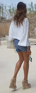 Flat ass leggy girl in denim shorts