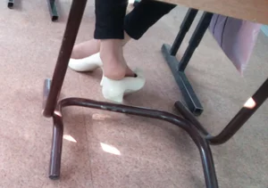 Feet in Pantyhose With High-Heeled Shoes Taken Off Under Desk Creepshot