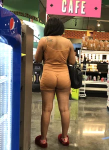 Latina with hard nipples and a big booty in tight spandex shorts outfit