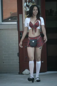 Two sexy Tilted Kilt employees showing cleavage and cheeks