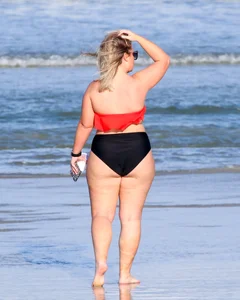 Thick BBW blonde lady in a bikini at the beach