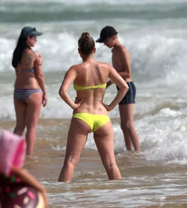 Big booty white girl in a yellow bikini at the beach