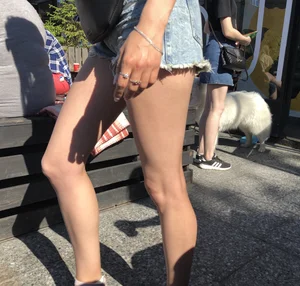 Girl in Denim Shorts with Amazing Hot Legs Fixing Her Sandals Street Candid Photo Gallery