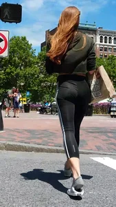 Redhead in black spandex in the sun