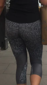Sexy girl walking in grey patterned leggings with friend in tight jeans