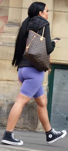 Wide hipped, juicy fronted tanned brunette pawg struts in lycra shorts
