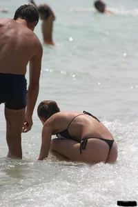 A bunch of sexy beach voyeur babes in bikinis, thongs and topless