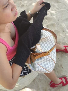 Asian chick downbloused showing nice cleavage and some bra