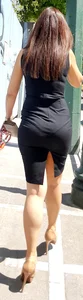 Brunette looking sexy in tight black dress with vpl