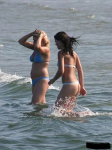 A bunch of sexy beach voyeur babes in bikinis, thongs and topless