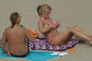 Topless girls on a beach in Barcelona