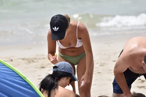 Two sexy ass girls on the beach in bikinis