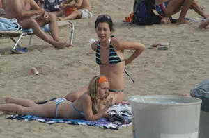 Topless girls on a beach in Barcelona
