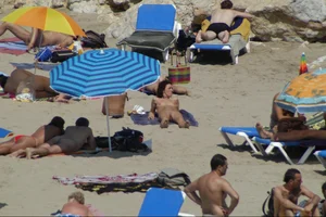 Girls on a nude beach in Sitges, Spain