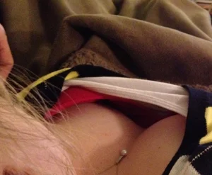 Girl Lying Under Plaid Downblouse Photo