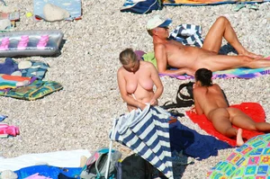 Ula FKK Sexy brunette on a nude beach topless, bottomless and with blue thong