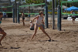 Beach volleyball blonde looking sexy and showing her body off