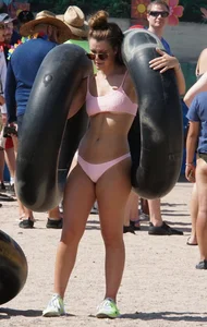Girls in bikinis getting ready for tubing
