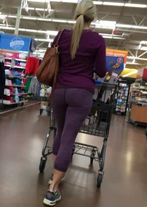 Sexy blonde shopping at Walmart in purple leggings with some vpl