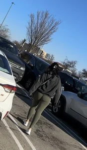 Sexy bubble butt in tight green leggings at the mall