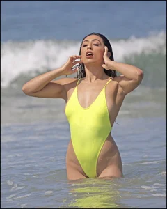Sexy ass beach babe in a yellow thong swimsuit