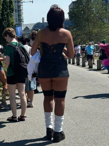Cheeks hangin’ out of little black skirt