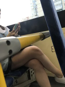 Girl in a Denim Dress and Sneakers with Nice Legs on the Bus Stop Candid Photo Gallery
