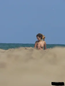 Sexy girls going topless at the beach showing off their sexy bodies