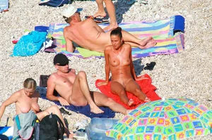 Ula FKK Sexy brunette on a nude beach topless, bottomless and with blue thong