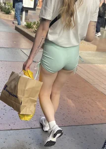 Sexy blonde in green shorts