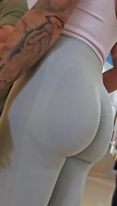 Fit blonde in grey leggings with a Fat Ass